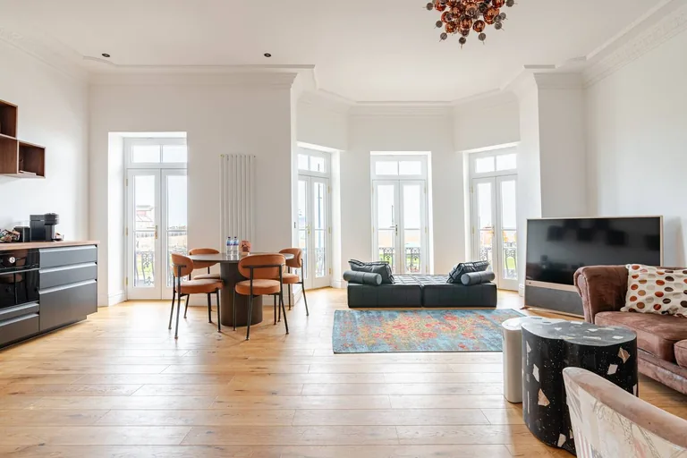 Belle Etage suite living room with bay windows and seafront views at Lavish Collections Great Yarmouth