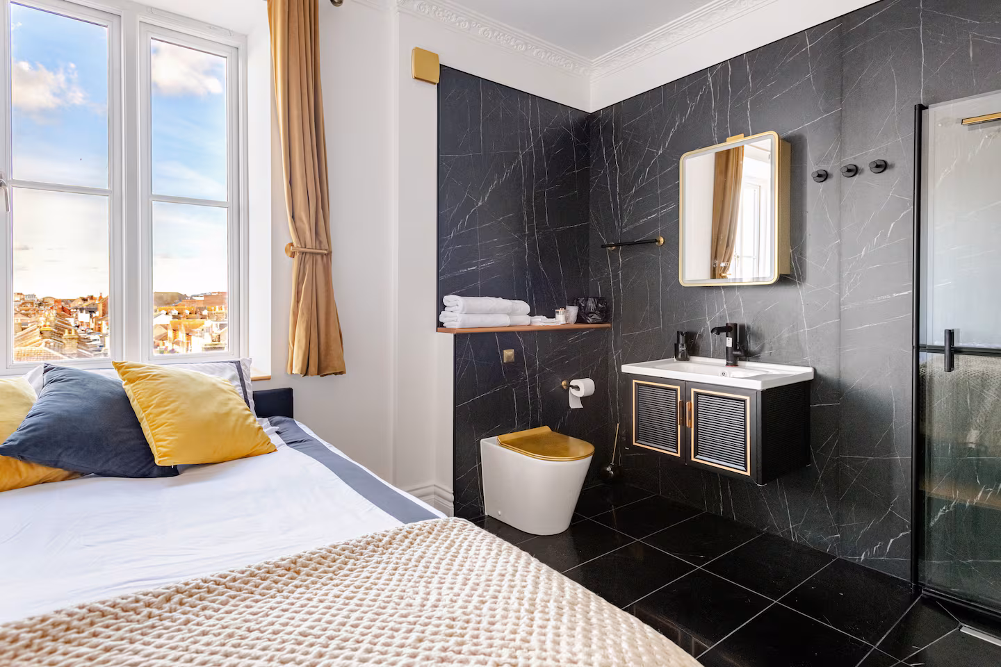 Ciel dOr suite king bedroom with refined gold accents and warm neutral tones at Lavish Collections Great Yarmouth