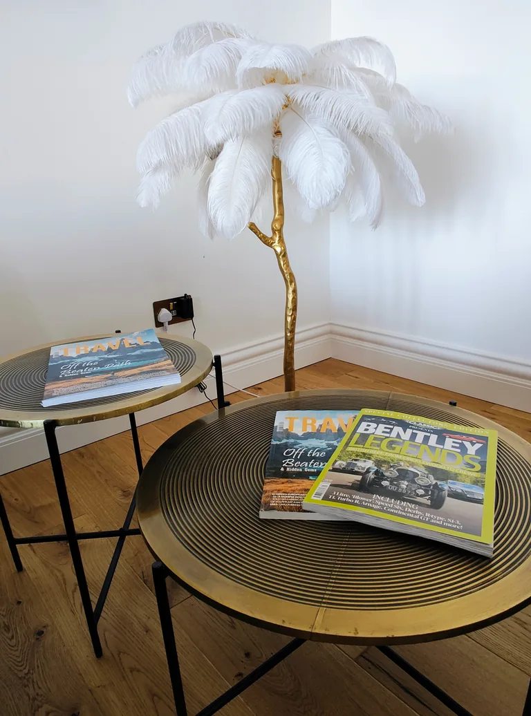 Ciel dOr suite refined decorative details with gold tables and white feather palm lamp at Lavish Collections Great Yarmouth