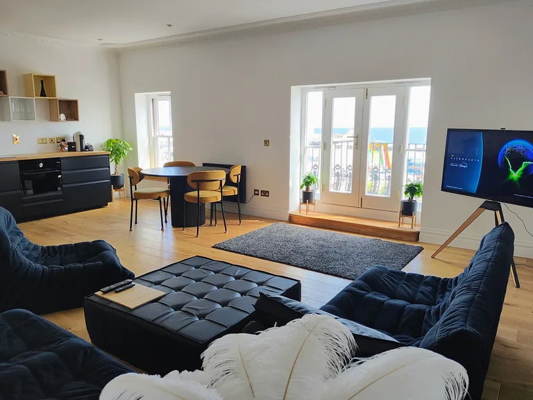 Ciel dOr suite open-plan living dining and kitchen area with seafront French doors at Lavish Collections Great Yarmouth