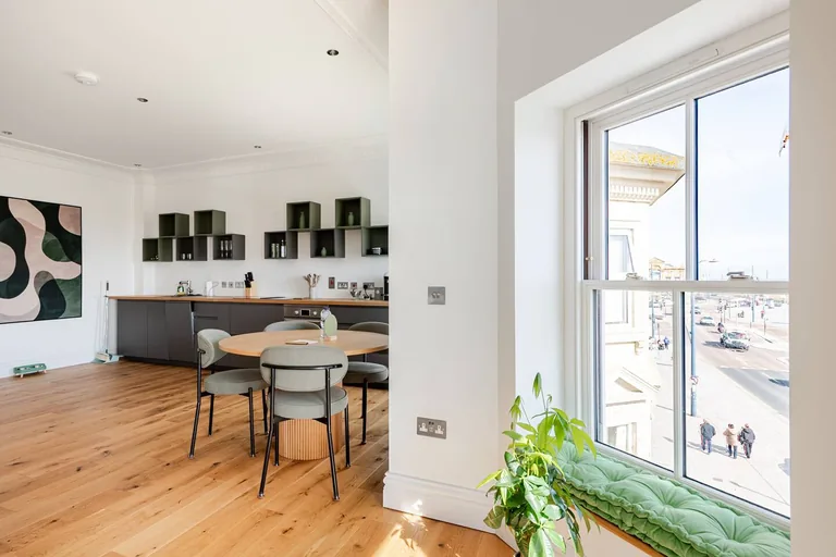 Seraphine suite dining area with seating for four and seafront views at Lavish Collections Great Yarmouth
